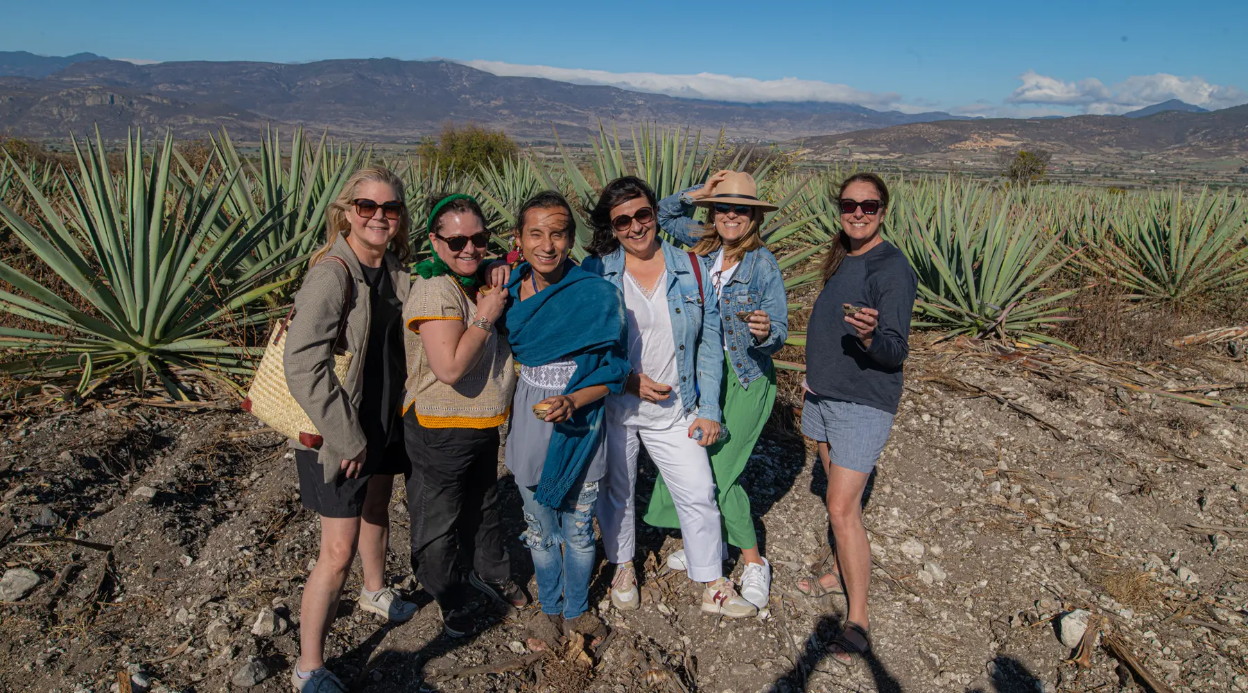 A group of women among agave fields in Oaxaca